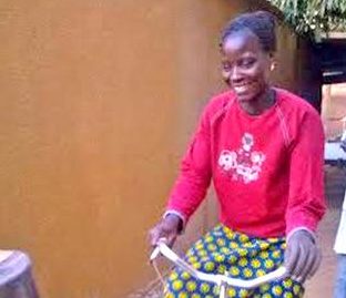 As a part of the Women's Aid Fund, Elizabeth is now able to happily ride a bicycle with the use of her prosthetic arm