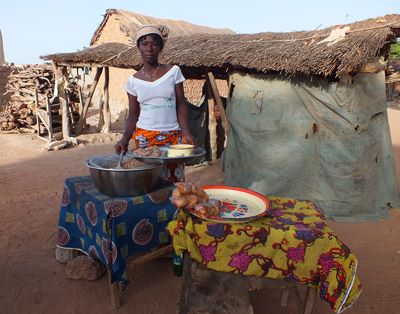 African woman seeling food