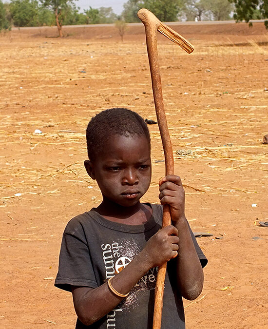 Life in African villages.  Even the youngest have work to do.